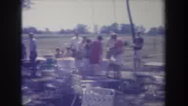 Michigan USA (1968): Many Men By A Lake With Some Tables Around And A Very Thin
