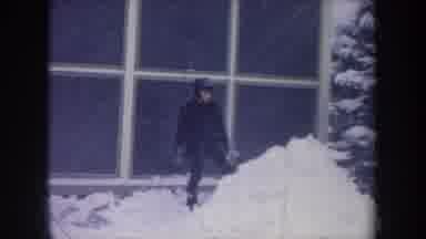 Michigan USA (1968): Young White Male Patting Down Snow On A Cold Winter Day In