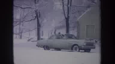 Michigan USA (1968): Person Getting Into The Passenger Side Of A Car While It Is