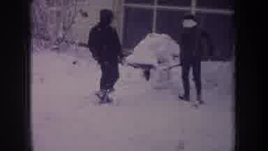 Michigan USA (1968): Two Teen Boys Building An Igloo Or Ice Cave In Their Backyard