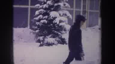 Michigan USA (1968): Child Shoveling Snow In Backyard