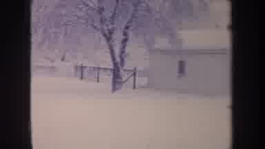 Michigan USA (1968): Snow Covered Garage And House In A Snow Covered Field