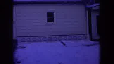 Michigan USA (1968): House With Snowy Front Yard In The Night With Moonlight