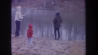Michigan USA (1968): Family Of Three Fishing In A Pond During Fall Season