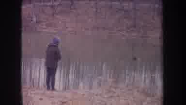 Michigan USA (1968): Besides The River There's One Person Fishing A Mother And A
