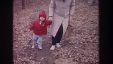 Michigan USA (1968): Baby And Mom Walking In Winter Woods Next To Body Of Water