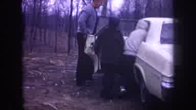 Michigan USA (1968): Two Children And An Adult Getting Into A Car And A The Woods