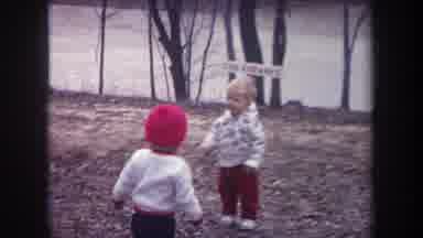 Michigan USA (1968): Cute Toddlers Out Of Doors Interacting With One Another In