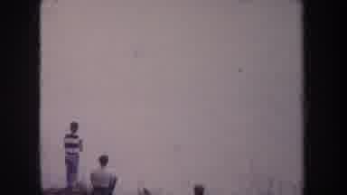 Michigan USA (1968): Three Boys Catching Fish At A Foggy Lake During The Daytime