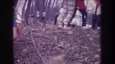 Michigan USA (1968): Toddler Learning To Walk With Adults Nearby In A Campground