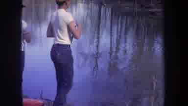 Michigan USA (1968): Kid Fishing Catches A Fish And Starts To Remove It From The