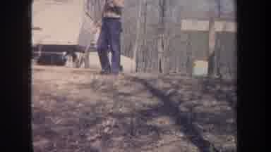 Michigan USA (1968): Two Boys Are Fishing Near By A Pond And A Men Is Cleaning The