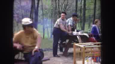 Michigan USA (1968): Group Of People Sitting On The Benches In The Nature Park And