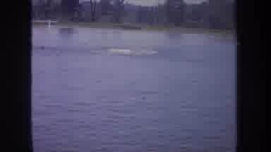 Michigan USA (1968): Man Swimming In A Lake Or River Going Back To A Boat