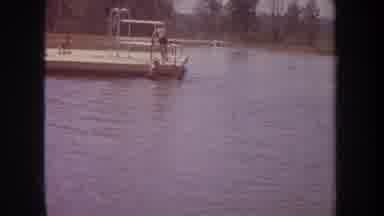 Michigan USA (1968): Kids Climbing From A Body Of Water Onto A Dock