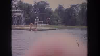 Michigan USA (1968): Family Gathering In A Park The Adults Sit Underneath The