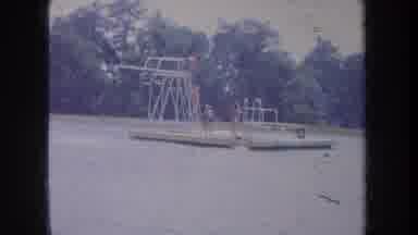 Michigan USA (1968): Long Line Of People Taking Turns On The Diving Board In The