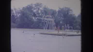 Michigan USA (1968): Kids Jumping Into The River With Diving Board