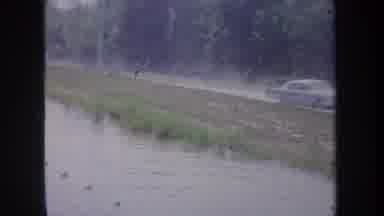 Michigan USA-1968: A Cameraman Checking Out Scenes Around A Small Lake While