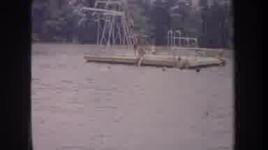Michigan USA (1968): Family And Kids Playing On A Dock Diving Boards And Swimming