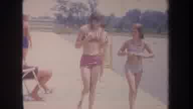 Michigan USA (1968): People Enjoying Their Time At The Beach In The Hot Sun