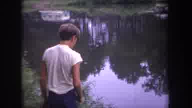 Michigan USA (1968): Friends Fishing In The River And Peeling Fish