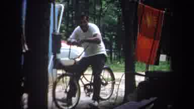 Michigan USA (1968): Man Who Is On A Bicycle Talking At A Another Man Who Is