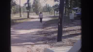 Michigan USA (1968): She Is The Only Woman Walking On A Road Outside The City