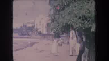 Hawaii USA (1969): People Are Shown At The Beach And A Boy Walks Towards Canoes