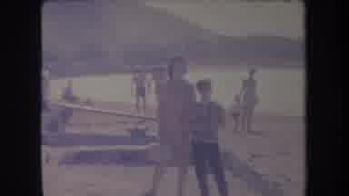 Hawaii USA (1969): Woman And Young Boy Visit The Beach Near The Mountains