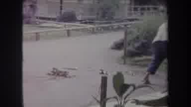 Hawaii USA (1969): Sweeping The Porch With People Laying In The Lawn Having A