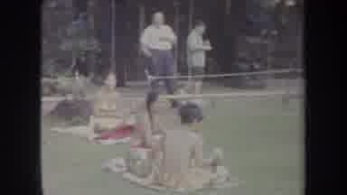 Hawaii USA (1969): People Sitting On Grass And Walking Building Entrance On A