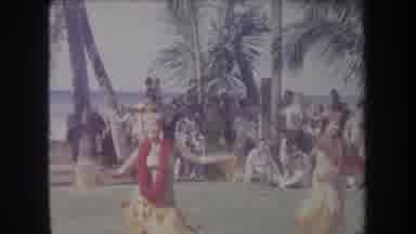 Hawaii USA (1969): Hawaiian Belly Dancers Dancing Under Sun Near Beach With Palm
