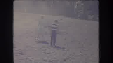 Hawaii USA (1969): People On The Shore Exploring Through The Sand And Viewing The