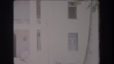 Hawaii USA (1969): Bright Older Building With Large Windows And A Balcony And Tall