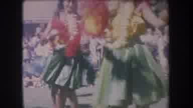Hawaii USA (1969): Two Young Women Wearing Flowers Dancing Together Wearing Green