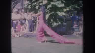 Hawaii USA (1969): Lady Dancing In A Purple Dress In Front Of Audience With