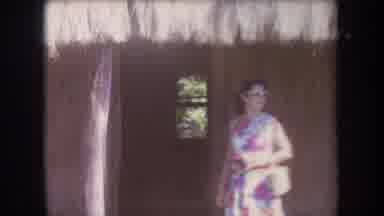 Hawaii USA (1969): Woman In Floral Dress Outside House