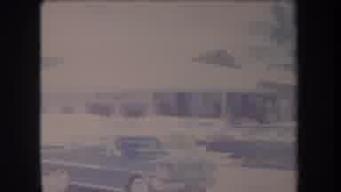 HAWAII USA-1969: Large Parking Lot Filled With Classic Cars Sits In Front Of A One-Story Building