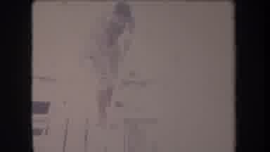 Hawaii USA-1969: Man Navigating Riverbank in Grass Skirt Barefoot