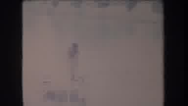 Hawaii USA (1969): Shirtless Man Standing On Makeshift Raft Paddling Down A Body