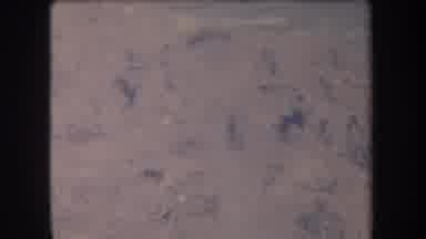 Hawaii USA (1969): Water Washes Over Rocks On A Beach Creating White Foam And