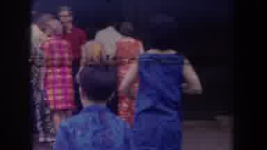 Hawaii USA (1969): People Wearing Colorful Clothes Passing Houses And Going Into A