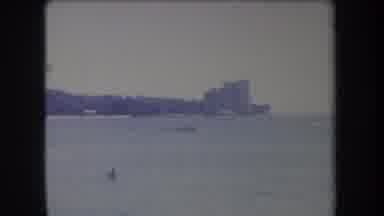Hawaii USA (1969): Small Boat Is Moving In The Distance In The Sea To The Shore