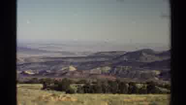 Western USA (1980): Mountains In The West With A Grassy Meadow In The Focus In A
