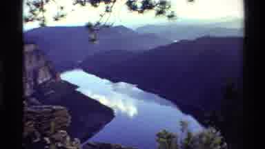 Western USA (1980): Sky Reflection On Calm River Next To Mountain On Clear Day