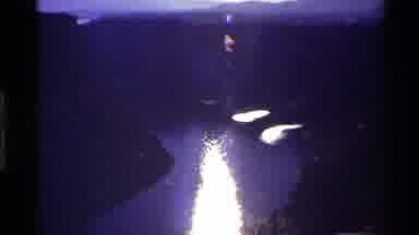 Western USA (1980): Bright Sunlight Reflecting On Curving River Water Down Steep