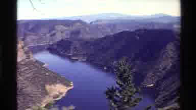 Western USA (1980): Lake That Is Surrounded By Small Mountains That Have Trees And