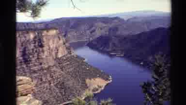 Western USA (1980): A Large Valley With A Calm Stream At The Bottom Surrounded By