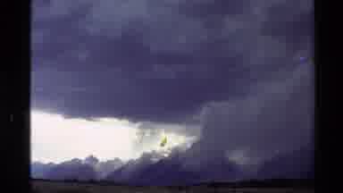 Western USA (1980): Big Moving Grey Cloud Casting Over The Mountain Tops